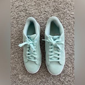 Mint green puma suede shoes.